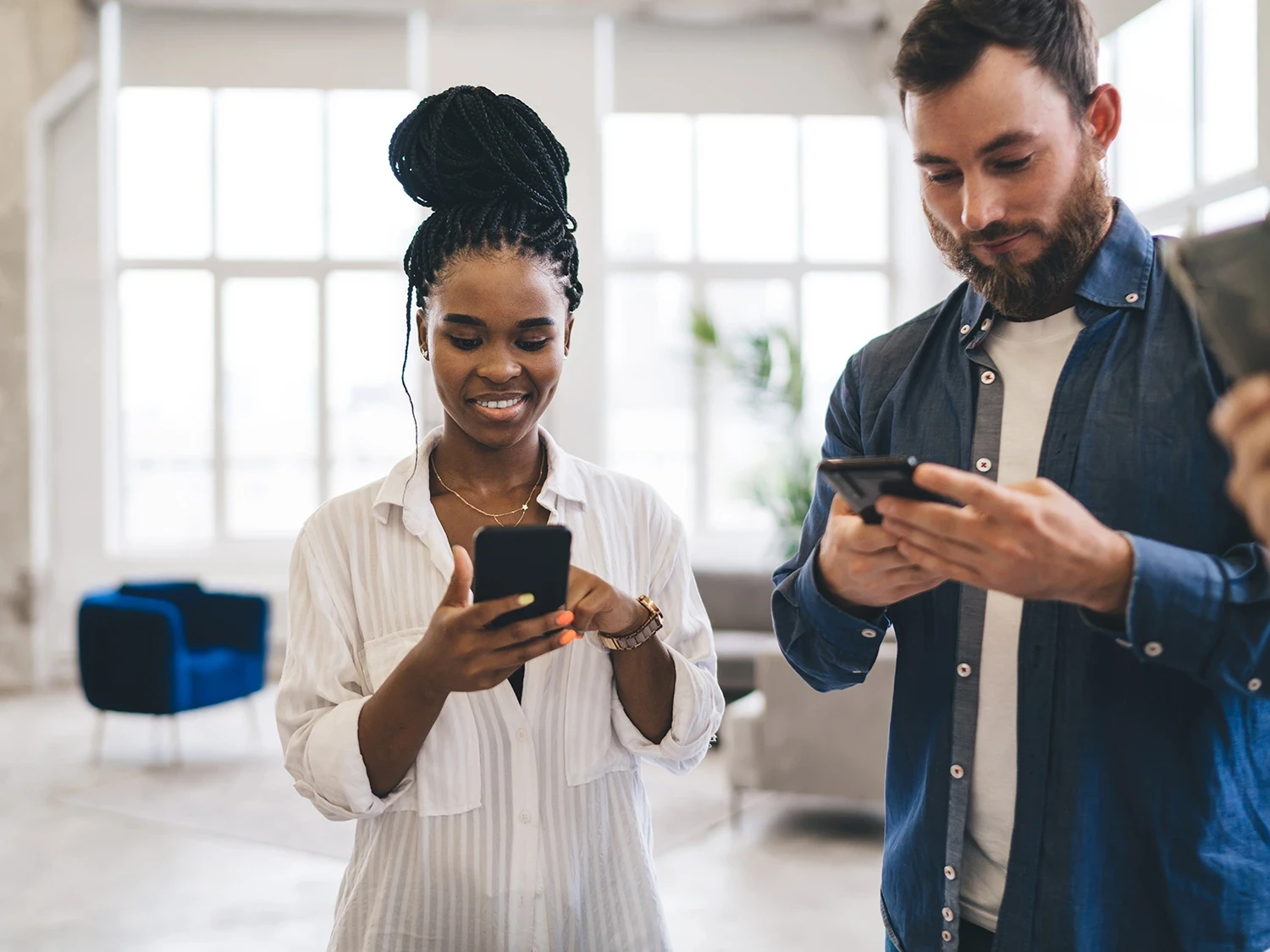 man and woman with phones